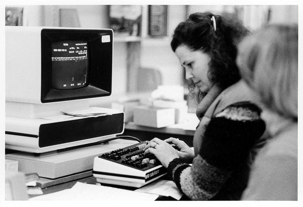 black and white image of Susan Henggeler on computer